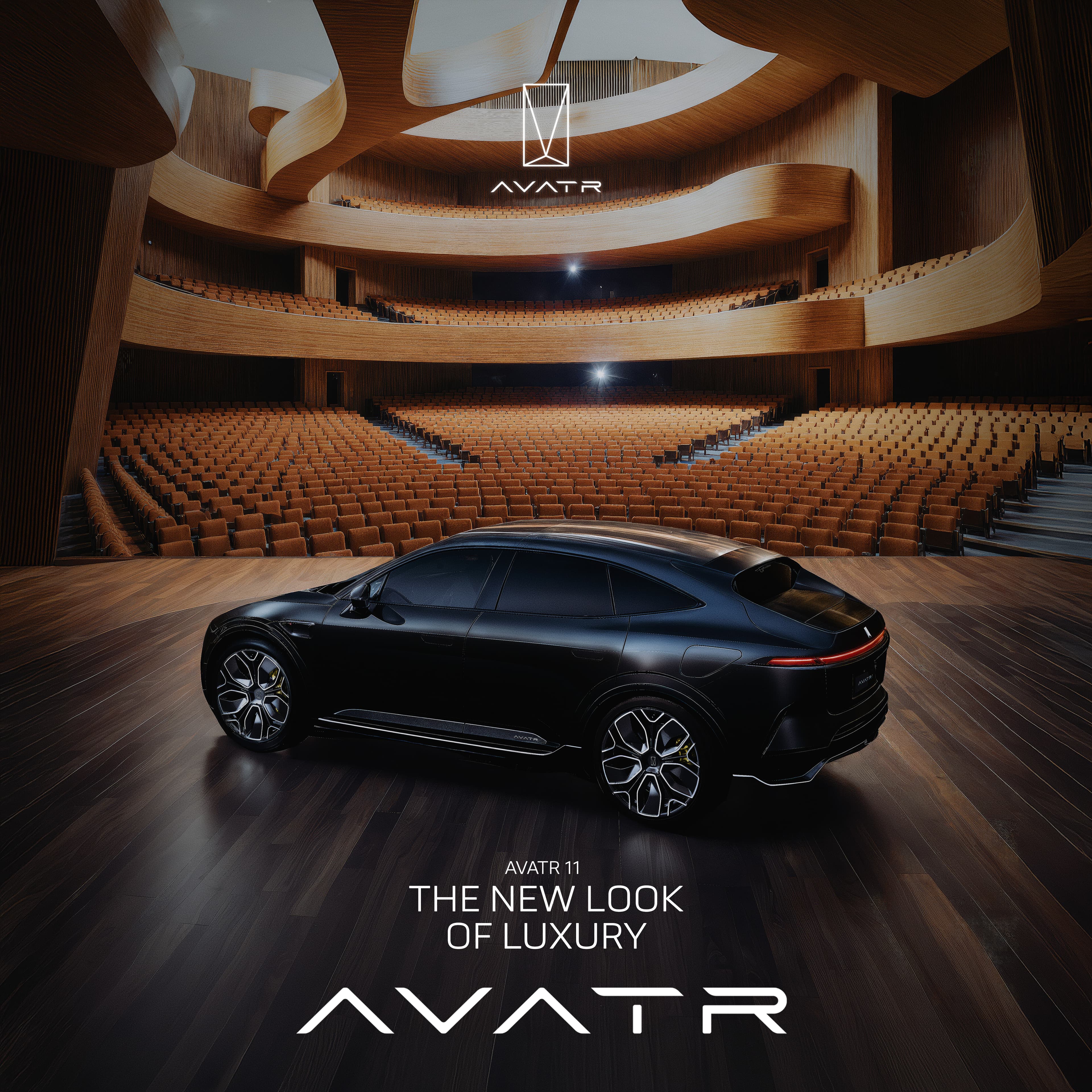 AVATR 11 in profile on the stage of a curved timber concert hall, empty auditorium behind