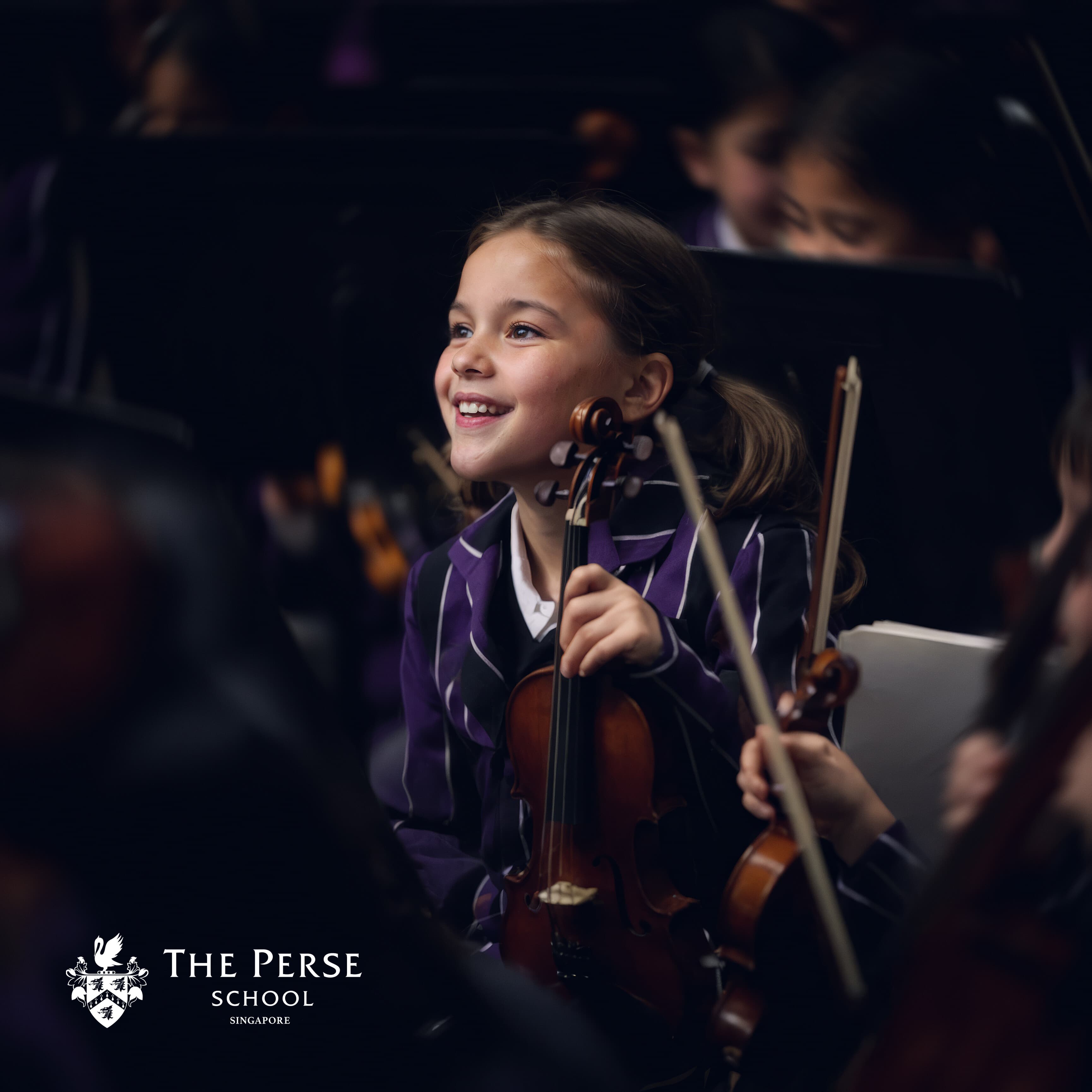 The Perse School Singapore: girl playing violin in the school orchestra