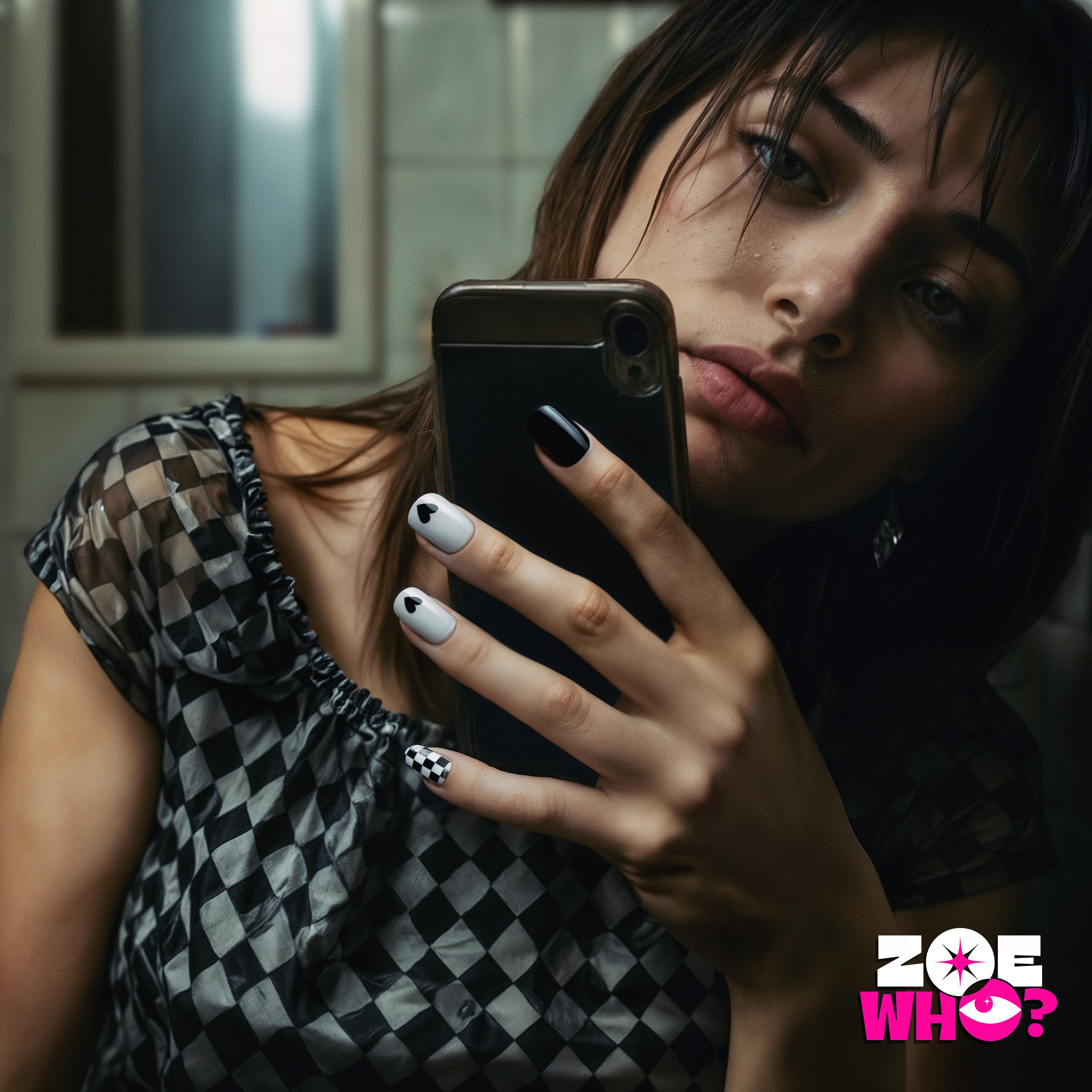 Zoe Who? nail art: model taking a mirror selfie, black and white nails