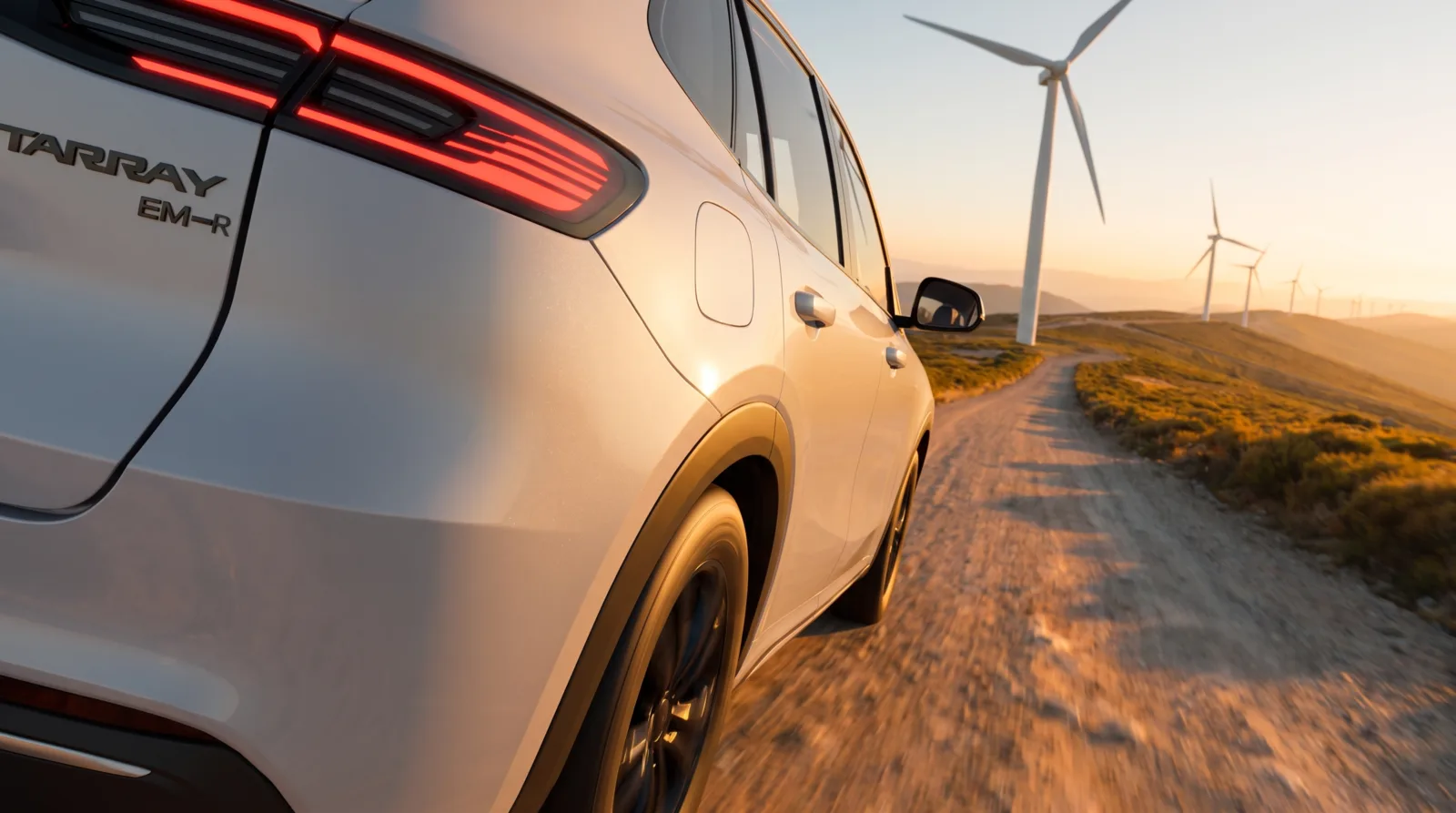 Rear quarter passing wind turbines at golden hour