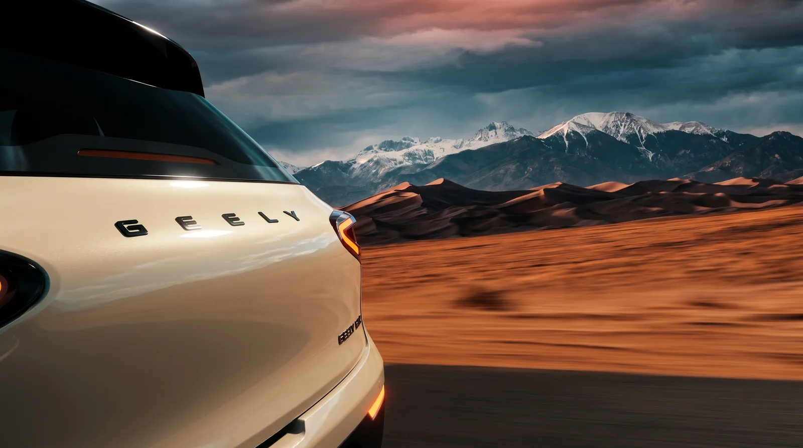 Tailgate against desert dunes and distant snow peaks